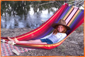 Teagan camping by the river 